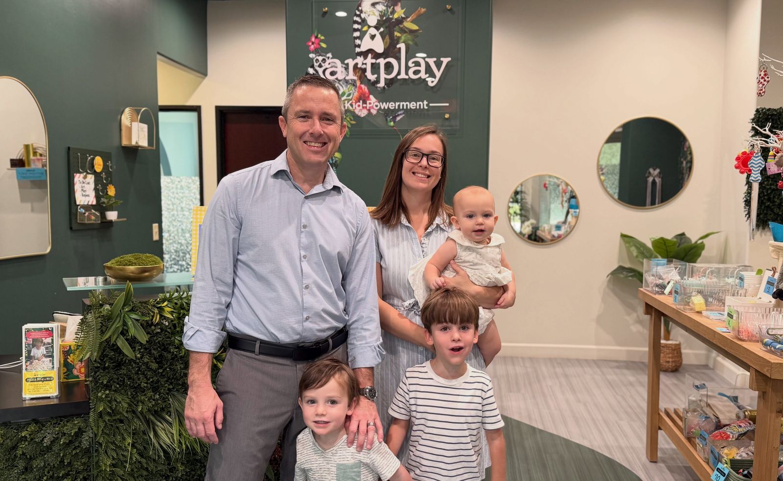 Brandon and Jenelle Gaylord with their three children in the ArtPlay lobby